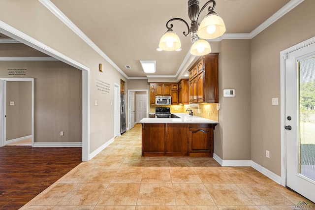 kitchen featuring kitchen peninsula, appliances with stainless steel finishes, hanging light fixtures, and ornamental molding