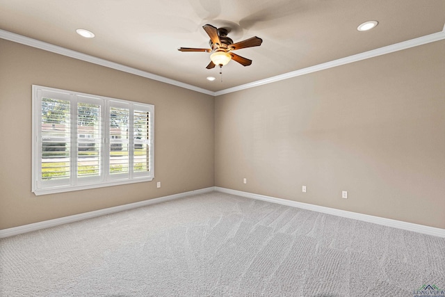 unfurnished room with ceiling fan, carpet floors, and ornamental molding