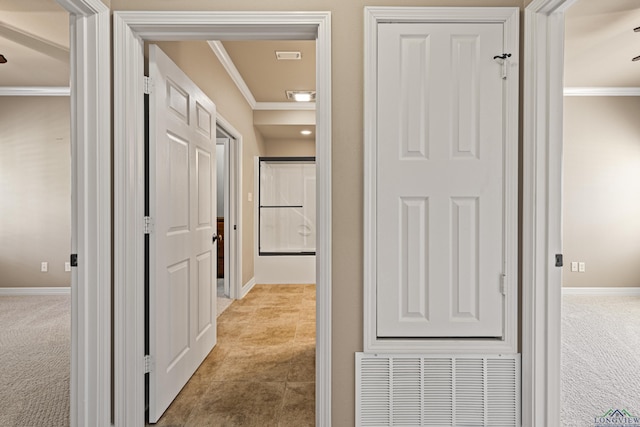 corridor featuring light colored carpet and crown molding