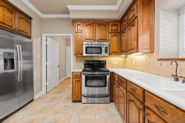 kitchen featuring decorative backsplash, stainless steel appliances, crown molding, and light tile patterned flooring