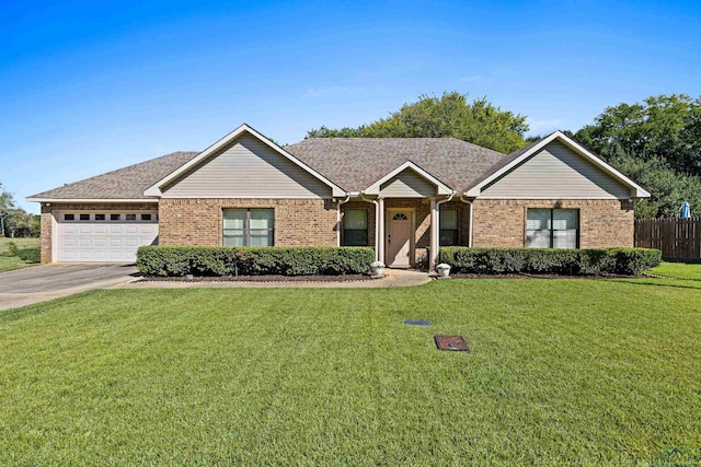 ranch-style home featuring a front yard and a garage