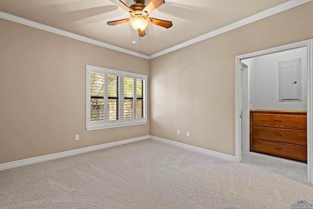 unfurnished bedroom featuring carpet, ceiling fan, crown molding, and electric panel