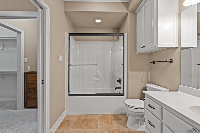 full bathroom featuring toilet, vanity, and combined bath / shower with glass door