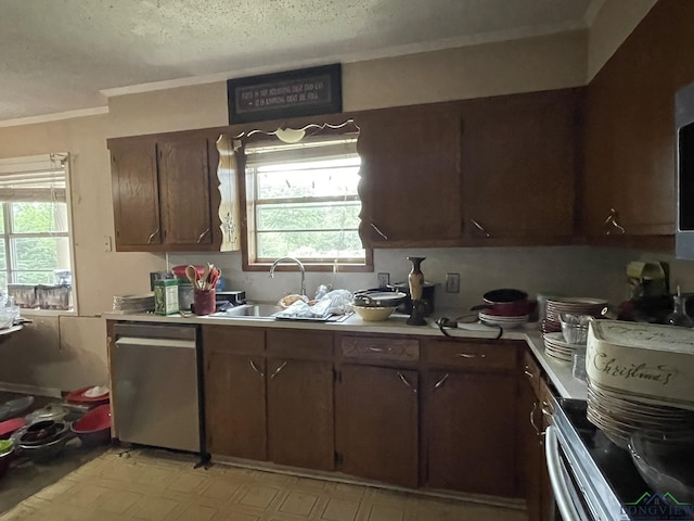 kitchen with a textured ceiling, dishwasher, plenty of natural light, and sink