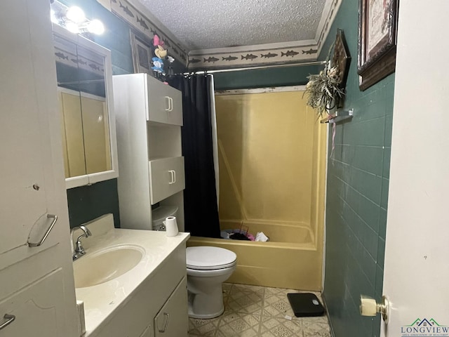 full bathroom with shower / bath combo with shower curtain, vanity, a textured ceiling, and toilet