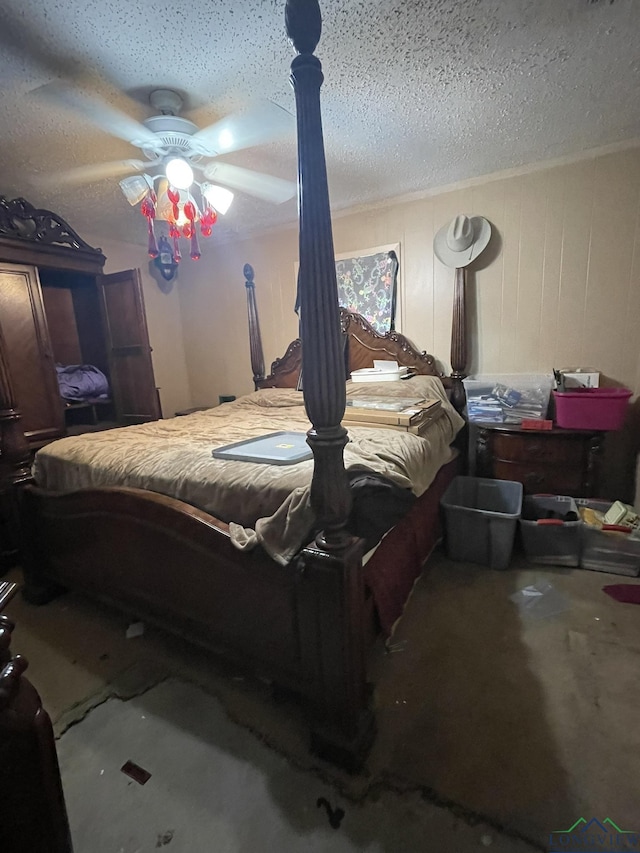 bedroom with a textured ceiling and ceiling fan