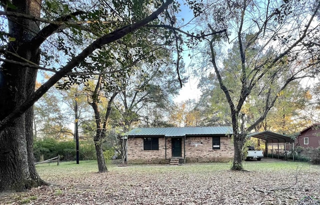 exterior space featuring a carport