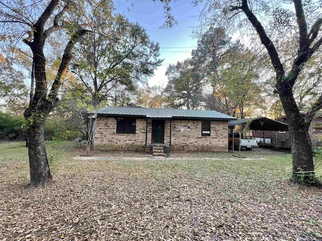 view of front of property with a carport