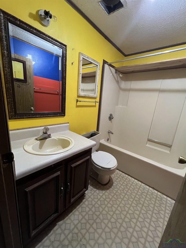 full bathroom featuring vanity, a textured ceiling, crown molding, shower / tub combination, and toilet