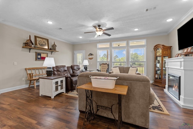 1767 County Road 3840, Hawkins, TX 75765 - living area featuring ornamental molding, a ceiling fan, dark wood finished floors, recessed lighting, and a glass covered fireplace