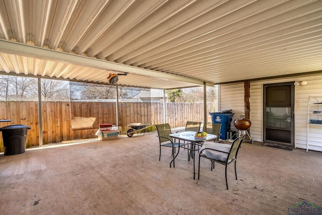 view of patio / terrace with outdoor dining area and fence