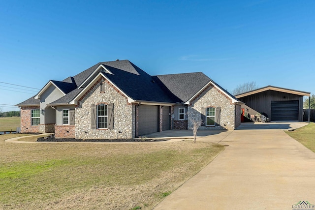 view of front of house with a front lawn and a garage