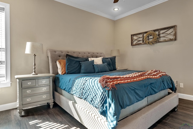 bedroom with multiple windows, dark hardwood / wood-style flooring, and ceiling fan