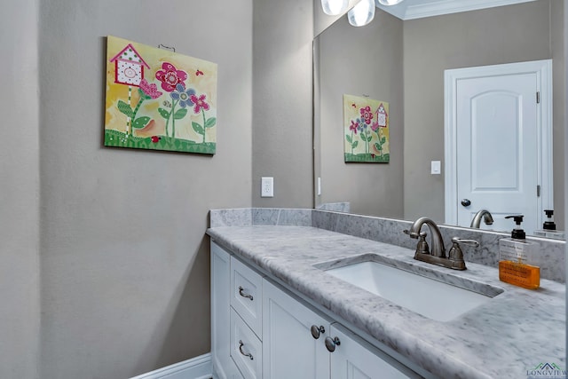 bathroom featuring vanity and crown molding