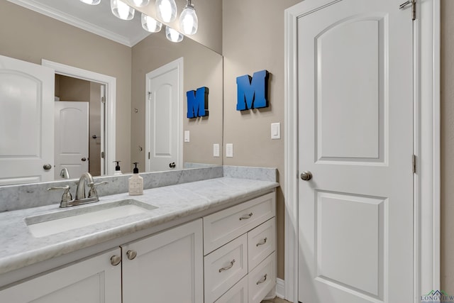 bathroom featuring vanity and crown molding