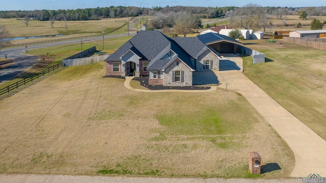 birds eye view of property with a rural view