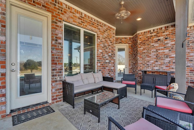 view of patio with an outdoor living space and ceiling fan