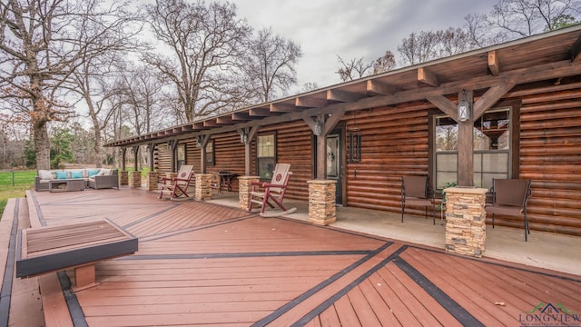 wooden terrace featuring outdoor lounge area and french doors