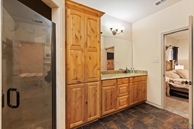 ensuite bathroom with a shower stall, vanity, ensuite bathroom, and visible vents