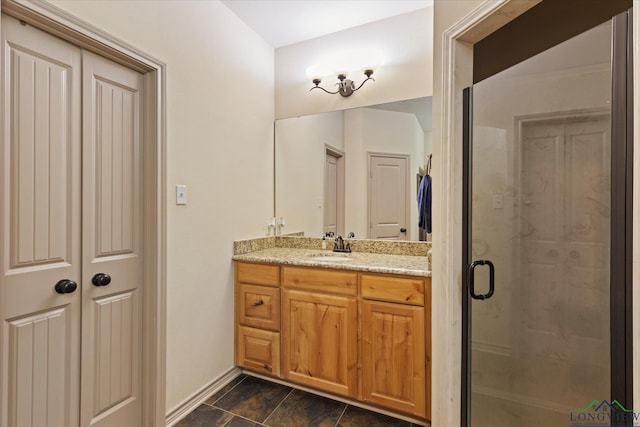 bathroom with vanity and a stall shower