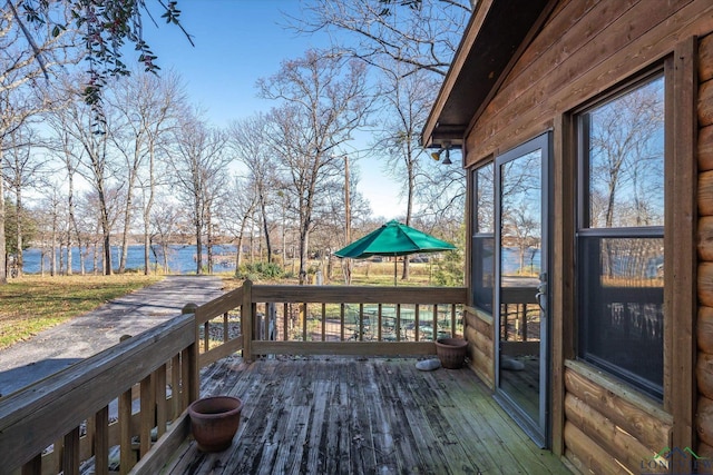 wooden terrace with a water view