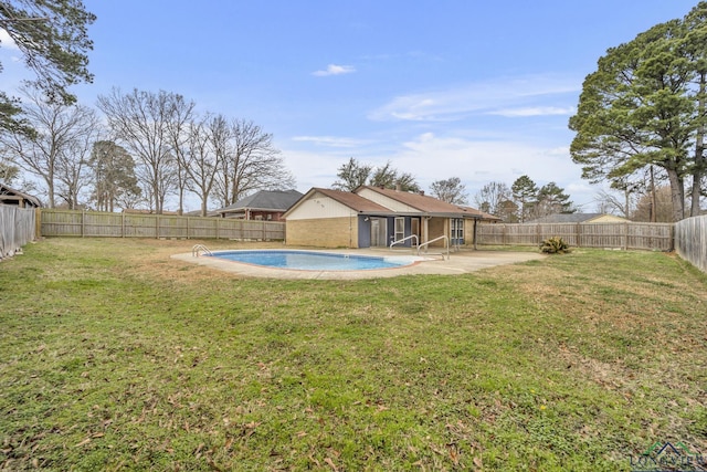 view of yard featuring a fenced in pool and a patio area