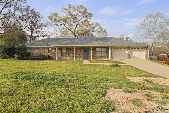 ranch-style home featuring a garage and a front yard