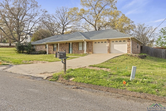 ranch-style house featuring a garage and a front lawn