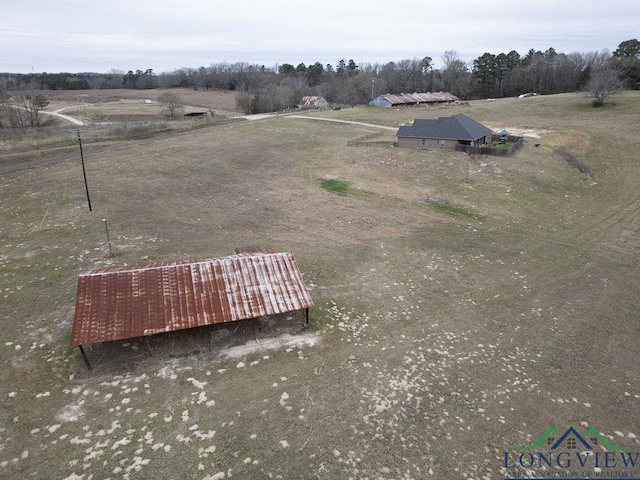 birds eye view of property featuring a rural view