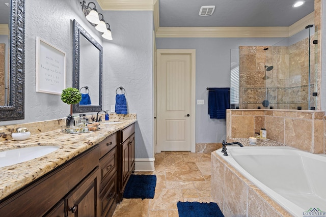 1600 Olympic Dr, Longview, TX 75605 - full bathroom with crown molding, stone tile floors, a garden tub, a shower stall, and double vanity