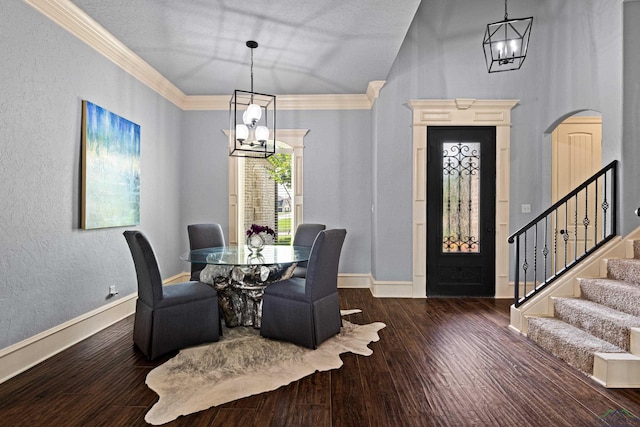 1600 Olympic Dr, Longview, TX 75605 - dining area featuring a chandelier, stairs, wood finished floors, baseboards, and ornamental molding