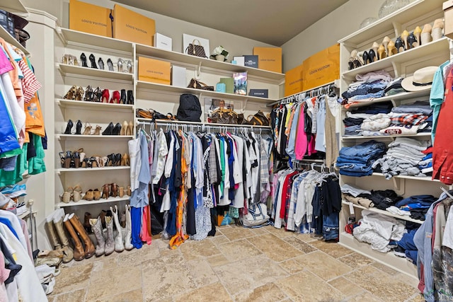1600 Olympic Dr, Longview, TX 75605 - walk in closet featuring stone tile floors
