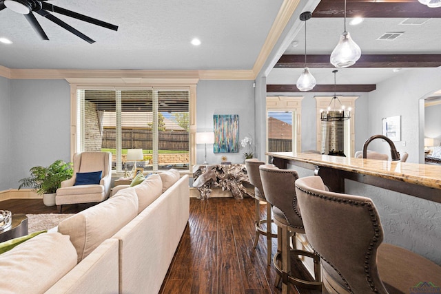1600 Olympic Dr, Longview, TX 75605 - living room featuring a ceiling fan, dark wood-style floors, arched walkways, recessed lighting, and crown molding