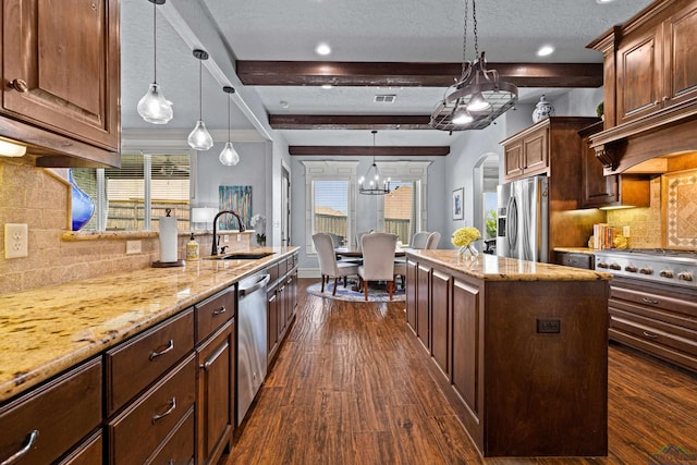 1600 Olympic Dr, Longview, TX 75605 - kitchen with appliances with stainless steel finishes, a sink, backsplash, dark wood-type flooring, and beam ceiling