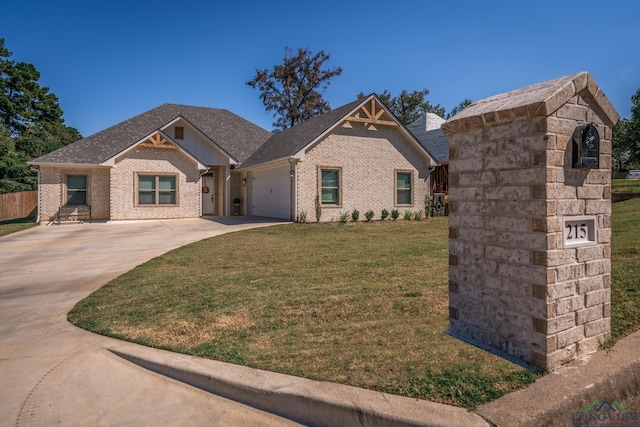 craftsman-style home with a front yard and a garage