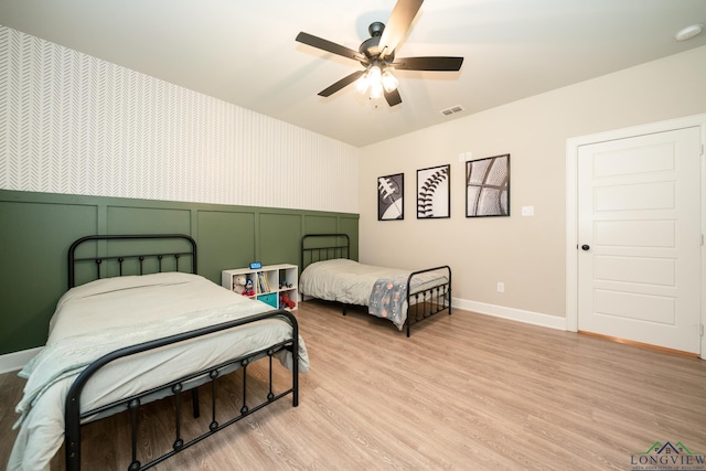 bedroom featuring ceiling fan and light hardwood / wood-style flooring