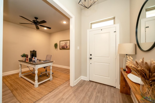 entryway featuring light wood-type flooring and ceiling fan