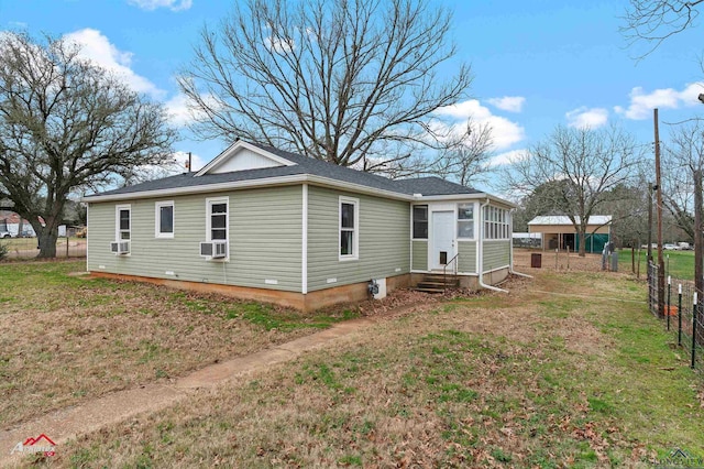 view of property exterior featuring cooling unit and a yard