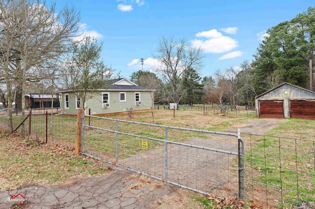 view of yard with a garage and an outdoor structure