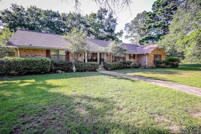 ranch-style home with a front yard