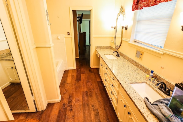 bathroom featuring hardwood / wood-style floors and vanity