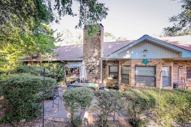 back of property featuring a patio area