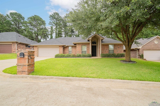 2532 Windmill Ln, Longview, TX 75601 - view of front of property with concrete driveway, a front yard, an attached garage, and brick siding