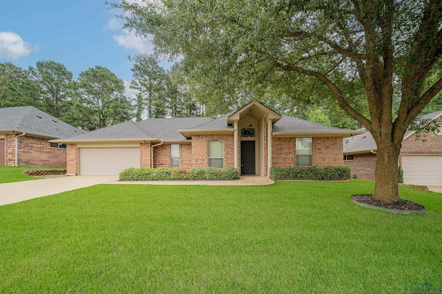 2532 Windmill Ln, Longview, TX 75601 - view of front of property featuring driveway, a garage, a front lawn, brick siding, and a shingled roof
