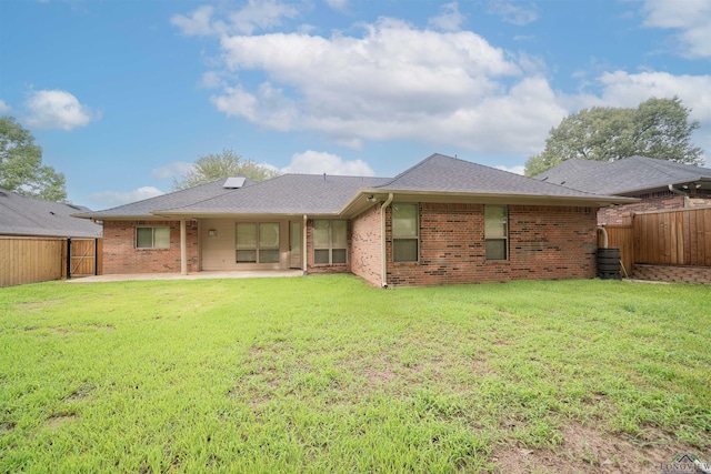 2532 Windmill Ln, Longview, TX 75601 - back of house with a patio area, a fenced backyard, brick siding, and a shingled roof