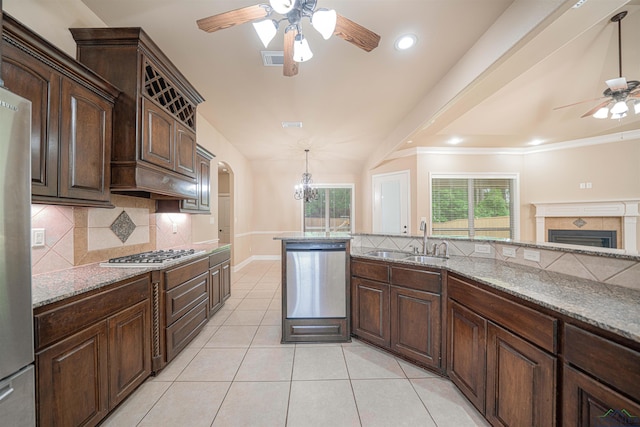2532 Windmill Ln, Longview, TX 75601 - kitchen featuring stainless steel appliances, a ceiling fan, decorative backsplash, light tile patterned floors, and recessed lighting
