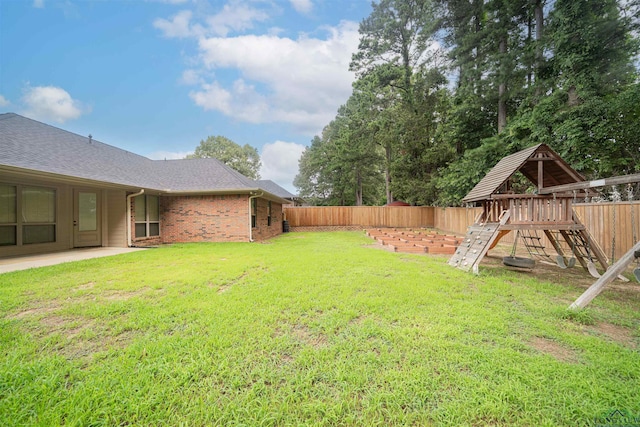 2532 Windmill Ln, Longview, TX 75601 - fenced backyard featuring a playground and a patio