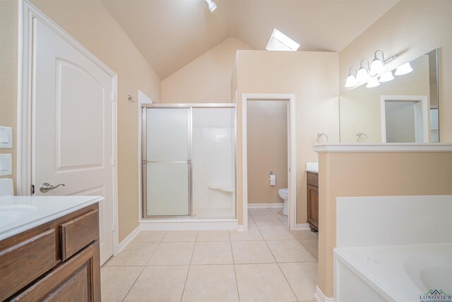2532 Windmill Ln, Longview, TX 75601 - bathroom with vanity, a stall shower, vaulted ceiling, tile patterned flooring, and a garden tub