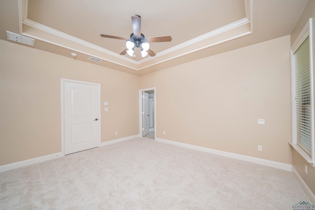 2532 Windmill Ln, Longview, TX 75601 - carpeted spare room featuring a tray ceiling, ornamental molding, and a ceiling fan