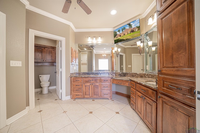 bathroom with toilet, ornamental molding, a ceiling fan, and tile patterned floors